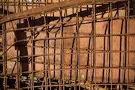 Rusty Metal Fence with Shadow Pattern