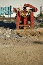 Red industrial machinery at a construction site