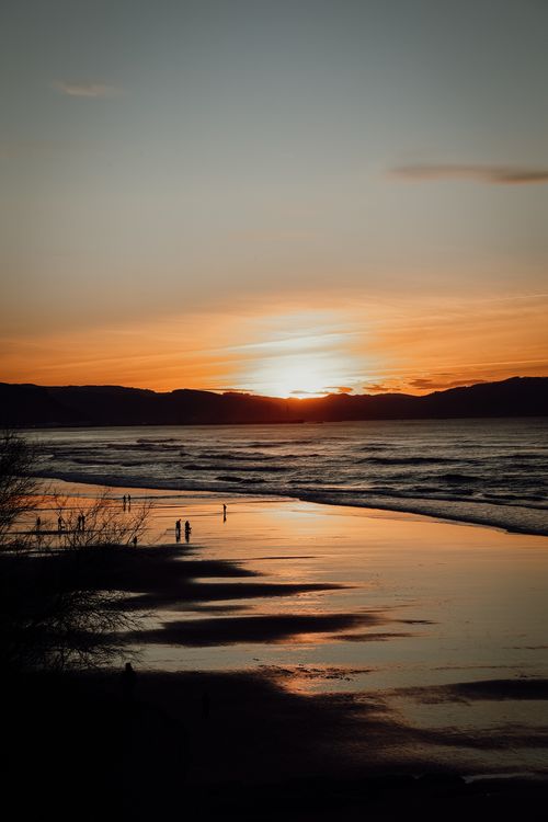 Free Stunning sunset view over Sopela Beach in Spain, capturing the serene waves and golden hues. Stock Photo