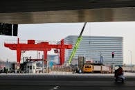 Urban Street with Construction Crane and Traffic