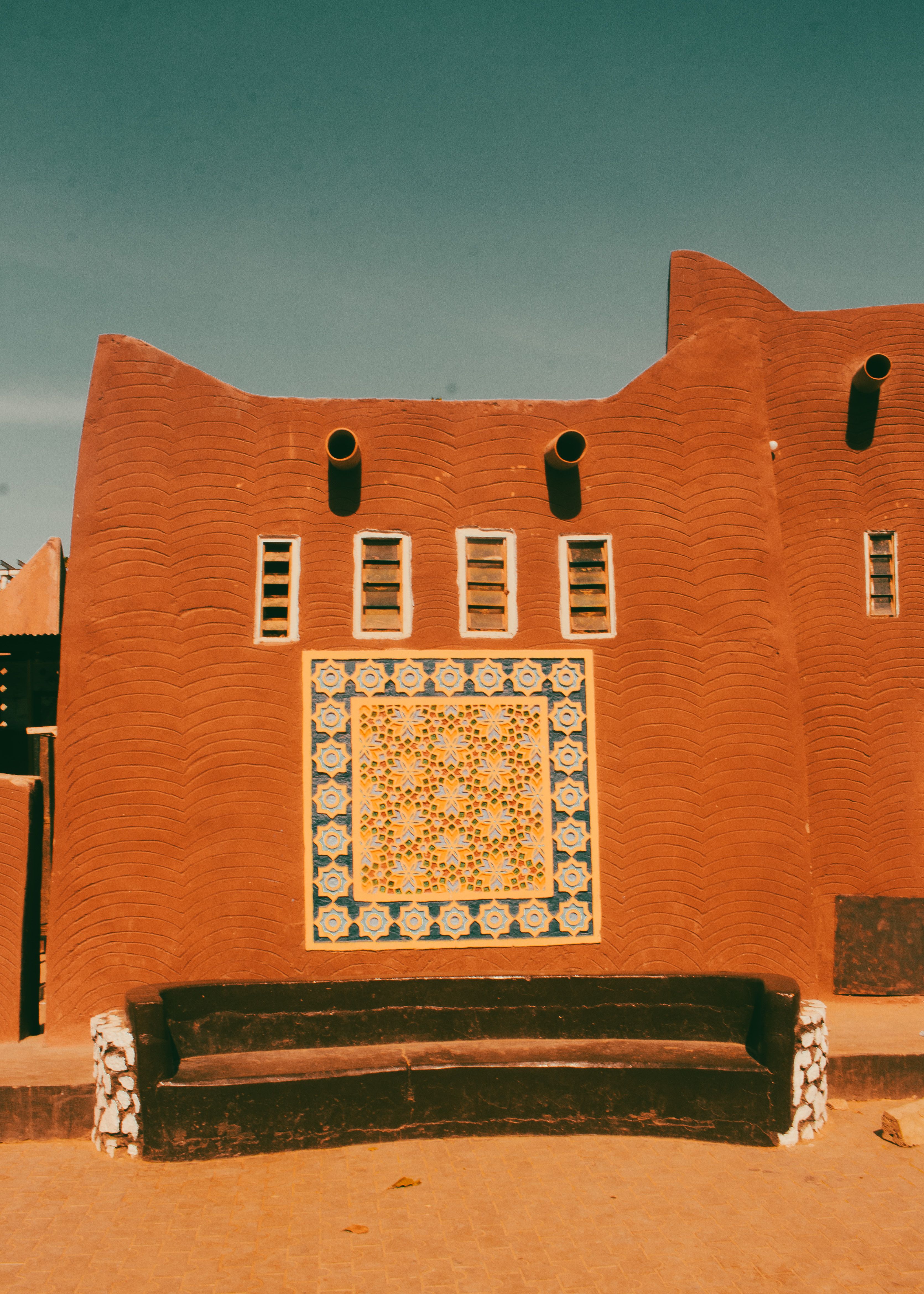 Traditional Adobe House with Ornate Tile Design · Free Stock Photo