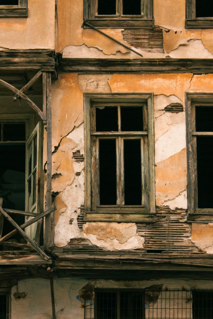 House exterior before repainting, weathered and worn