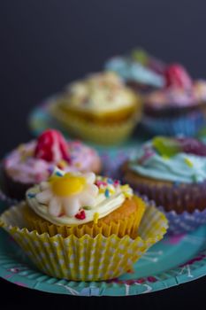 Vibrant cupcakes with creative frosting designs perfect for celebrations and parties.