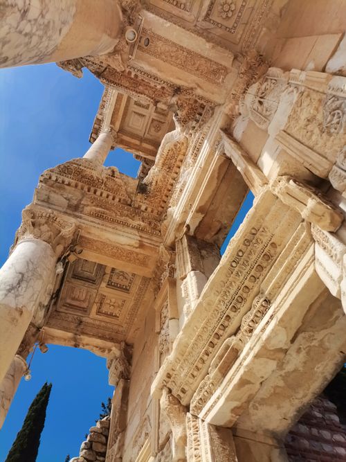 Free Stunning upward view of the ancient Ephesus ruins under a vibrant blue sky. Stock Photo