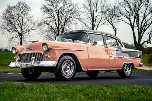 Free Pristine 1955 Chevrolet Bel Air in vintage pastel colors parked on an outdoor road. Stock Photo