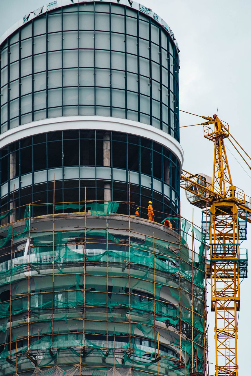 Skyscraper construction with crane in Nairobi, highlighting modern architecture and urban development.