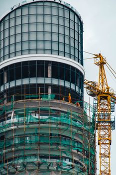 Skyscraper construction with crane in Nairobi, highlighting modern architecture and urban development.