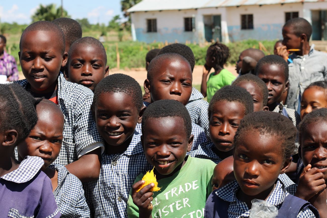 Children playing together in a sunny schoolyard