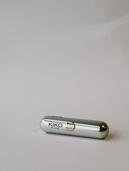 Side view of a KIKO Milano lipstick in silver packaging on a simple white background. Perfect for beauty product listings.