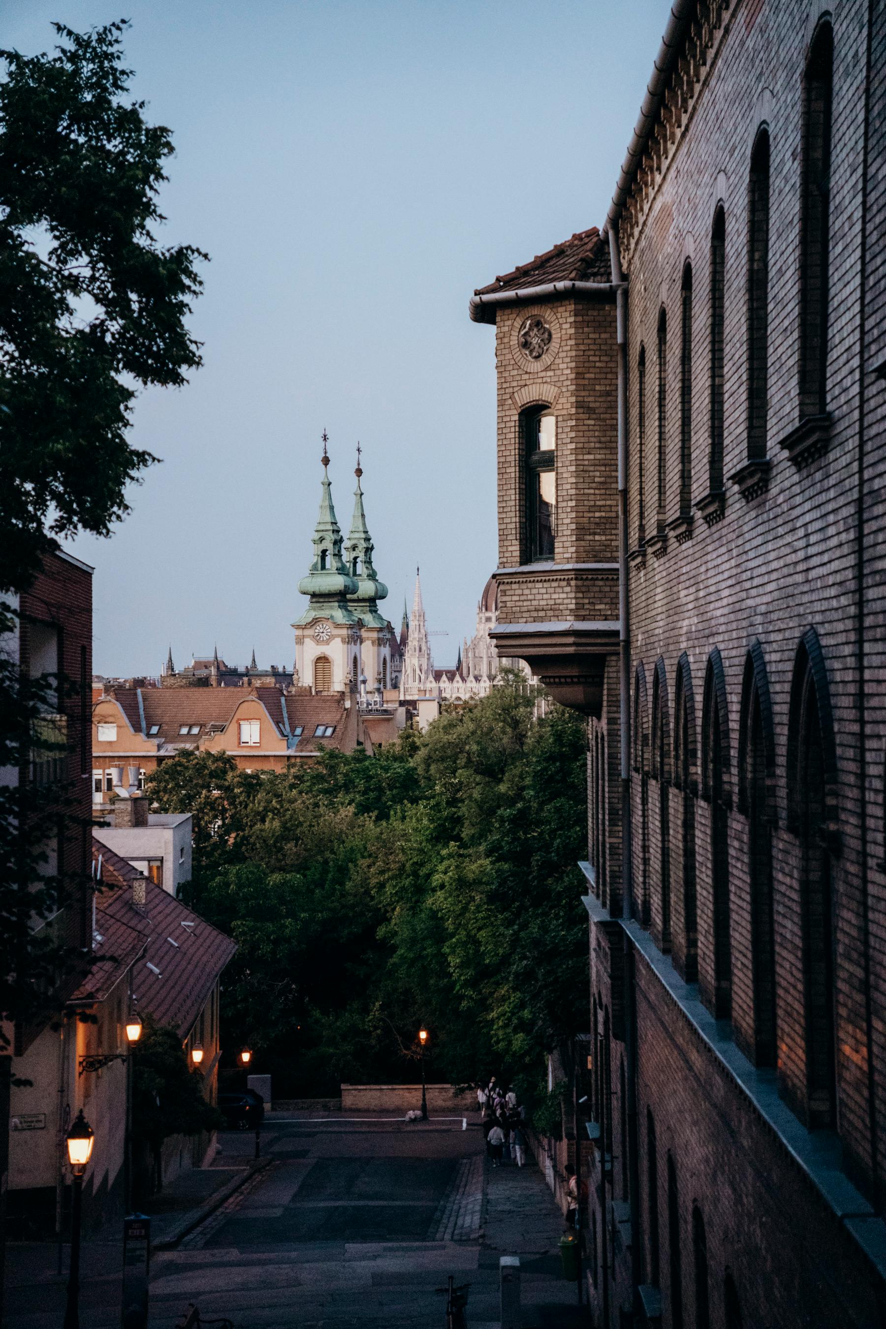 Captivating view of Budapest's historic architecture at twilight, featuring St. Mathias Church towers.