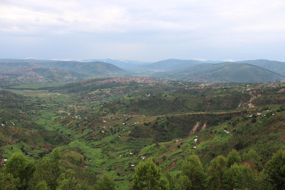 Breathtaking aerial view of Kigali's picturesque green hills and valleys, showcasing stunning Rwandan landscapes.