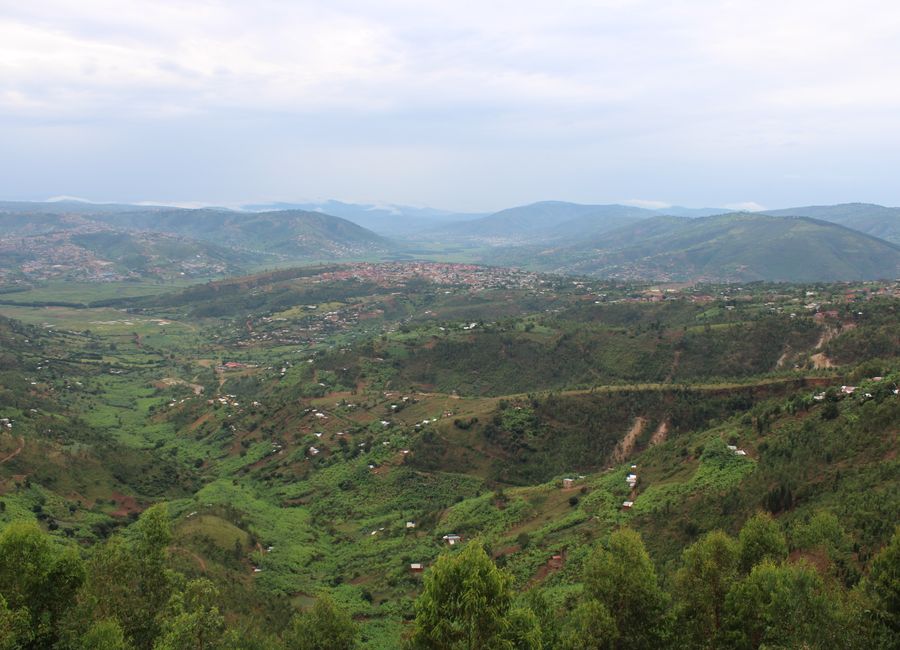 Breathtaking aerial view of Kigali's picturesque green hills and valleys, showcasing stunning Rwandan landscapes.