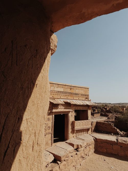 Free Explore ancient ruins with intricate carvings in the arid landscape of Jaisalmer. Stock Photo