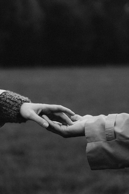 A touching moment captured in black and white, symbolizing connection.