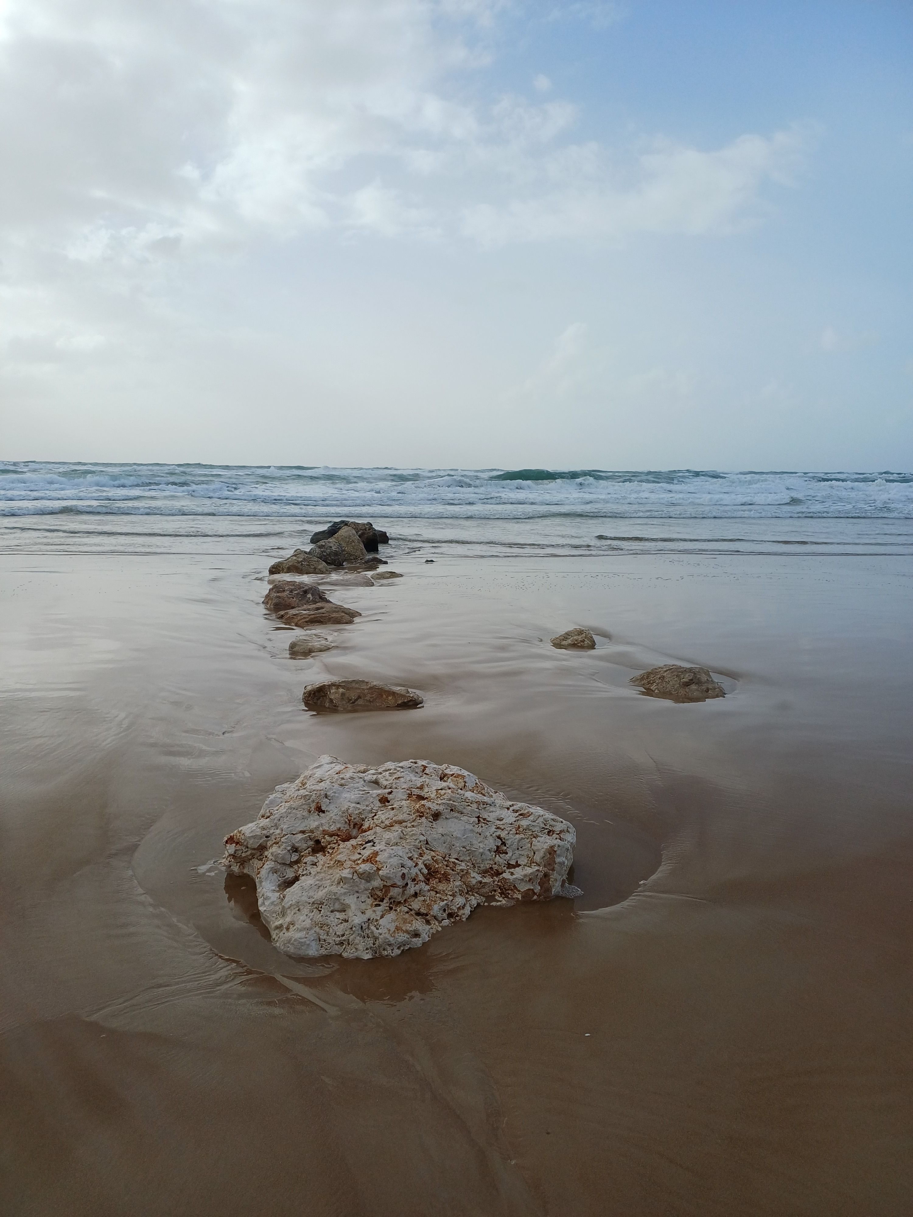 Serene Beach with Rocks at Haifa Shoreline · Free Stock Photo