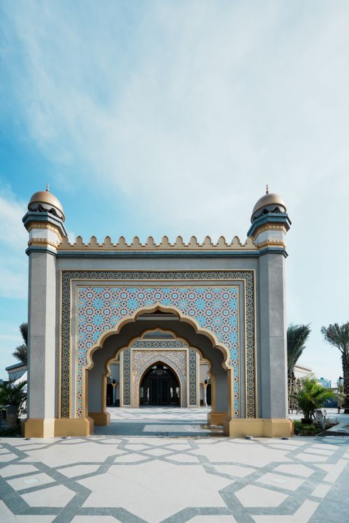 Free Stunning Islamic architectural design at a mosque in Jakarta, Indonesia under clear blue skies. Stock Photo