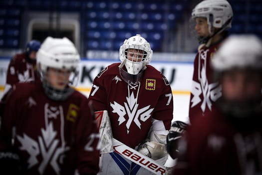 Ice hockey team in action during a game, showcasing teamwork and sportsmanship.