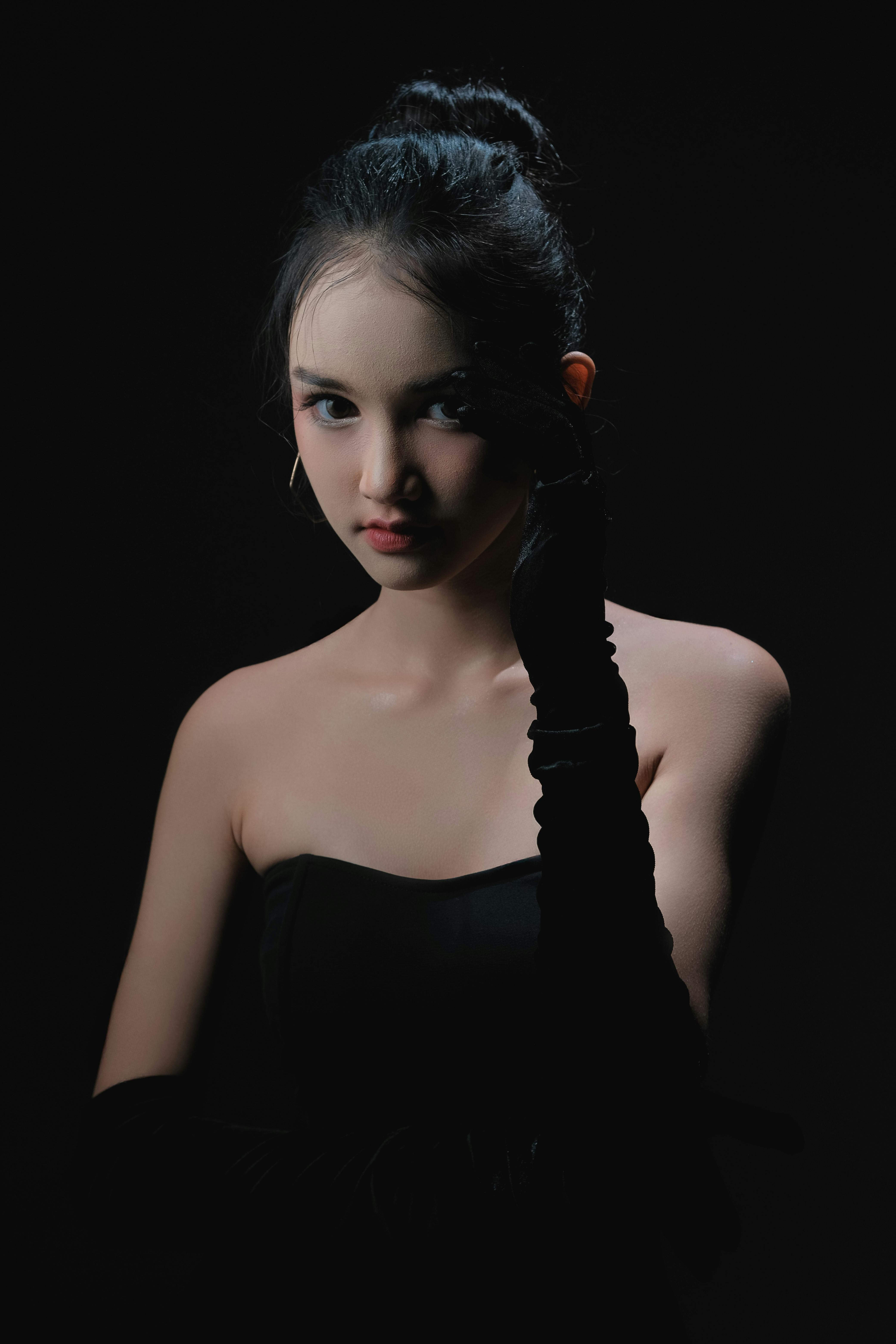 Elegant Portrait of Woman in Dramatic Lighting