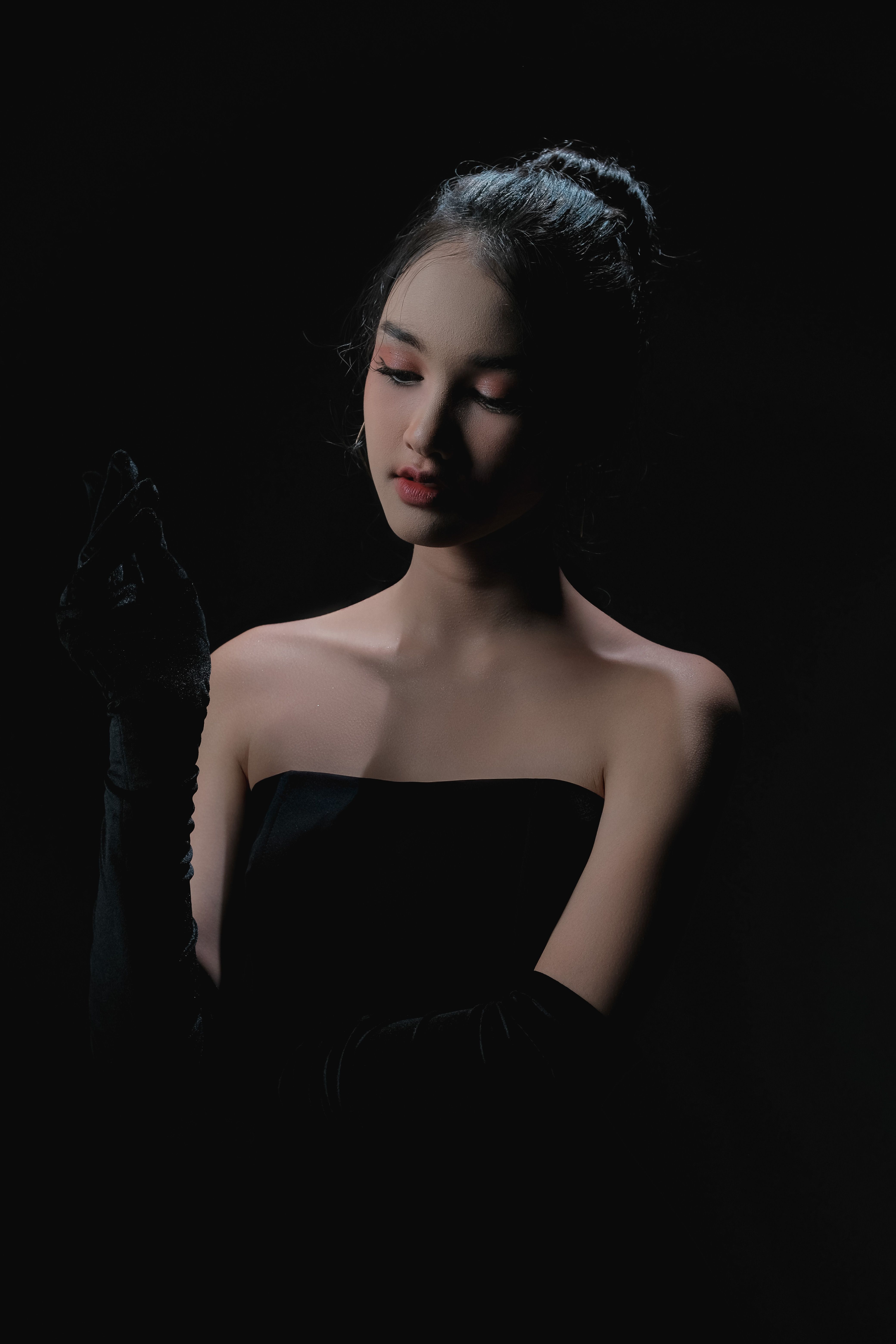 Elegant Woman in Black Dress Posing · Free Stock Photo
