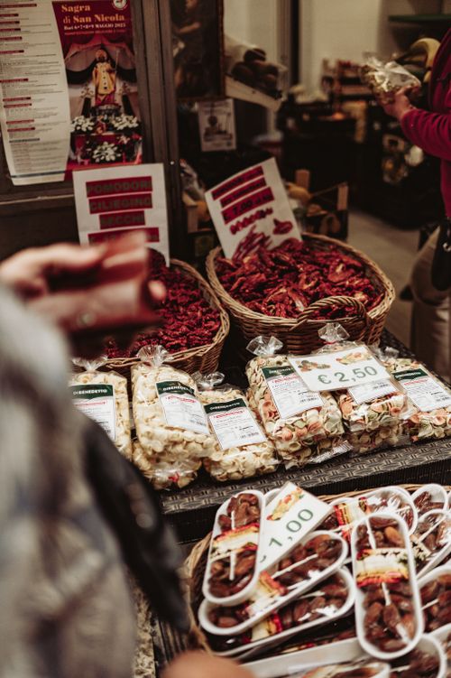 Free A colorful street market in Bari showcasing local spices and produce. Stock Photo
