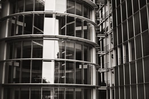 Close-up view of a modern architectural building facade with glass and steel structure in Berlin.