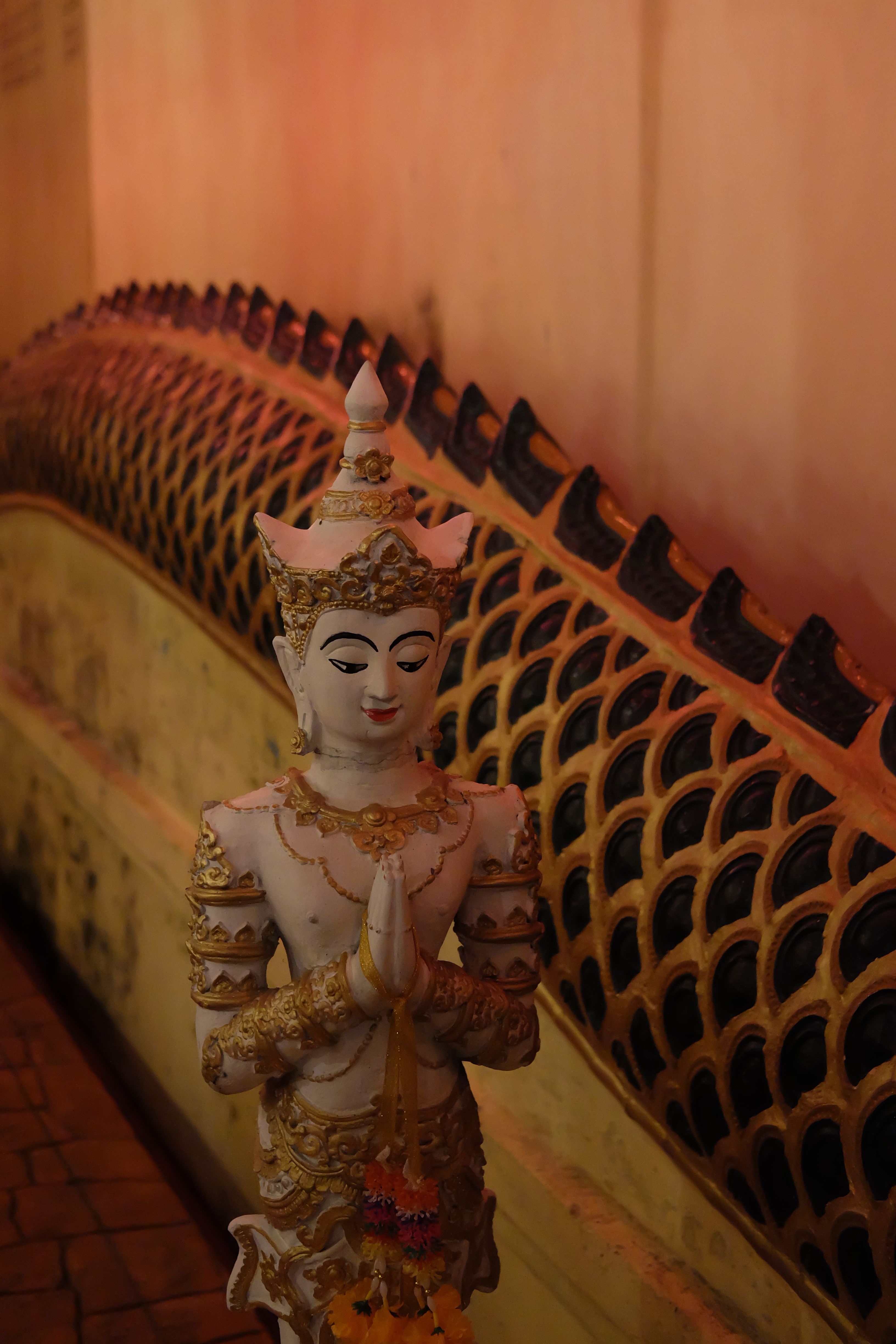 Intricate Buddhist Statue in Serene Temple Setting