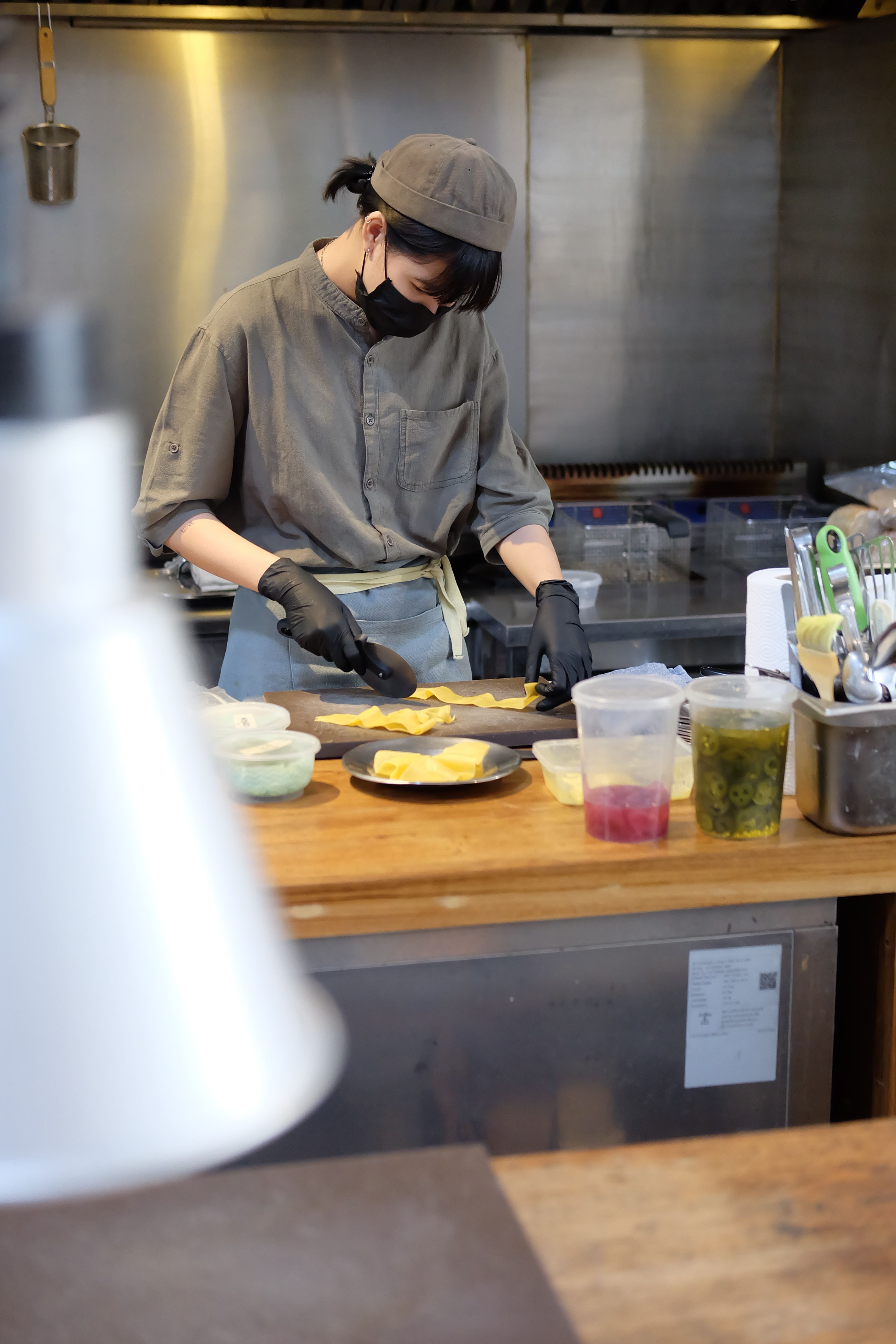 Chef preparing food in a professional restaurant kitchen