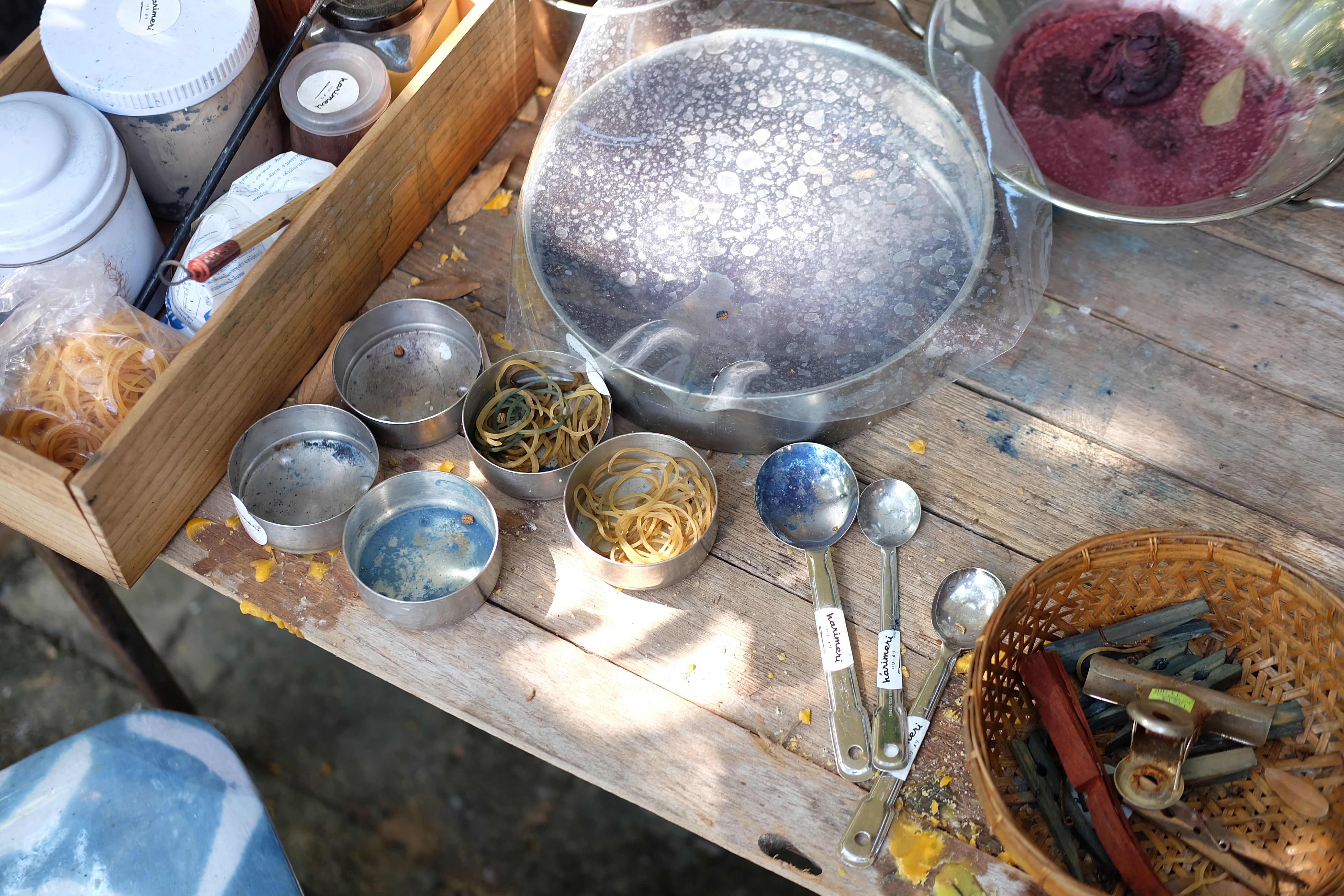 Aerial view of crafting materials on a rustic wooden table, highlighting DIY creativity.