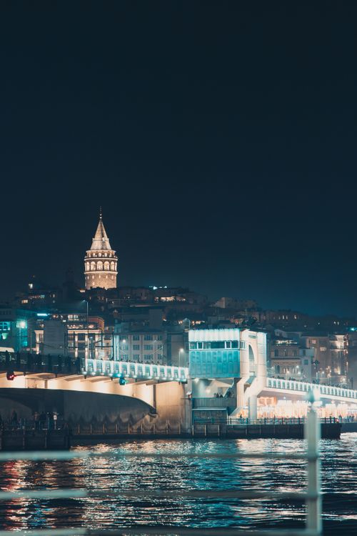 Free Night view of Galata Tower and the Galata Bridge in Istanbul, Türkiye, beautifully illuminated. Stock Photo