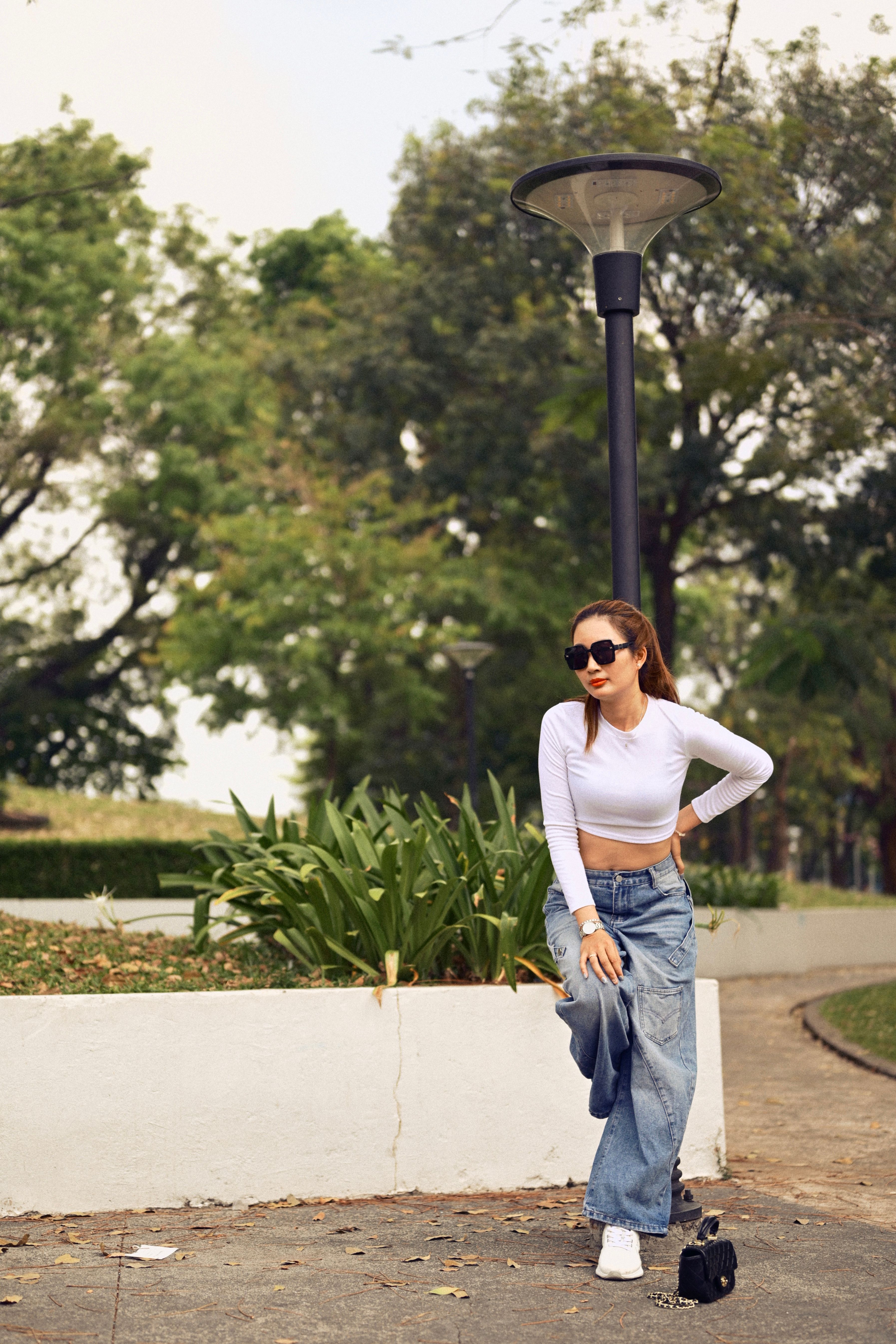 Fashionable Woman Relaxing in Urban Park · Free Stock Photo