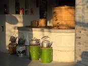 Traditional Chinese Kitchen with Steamers and Kettles