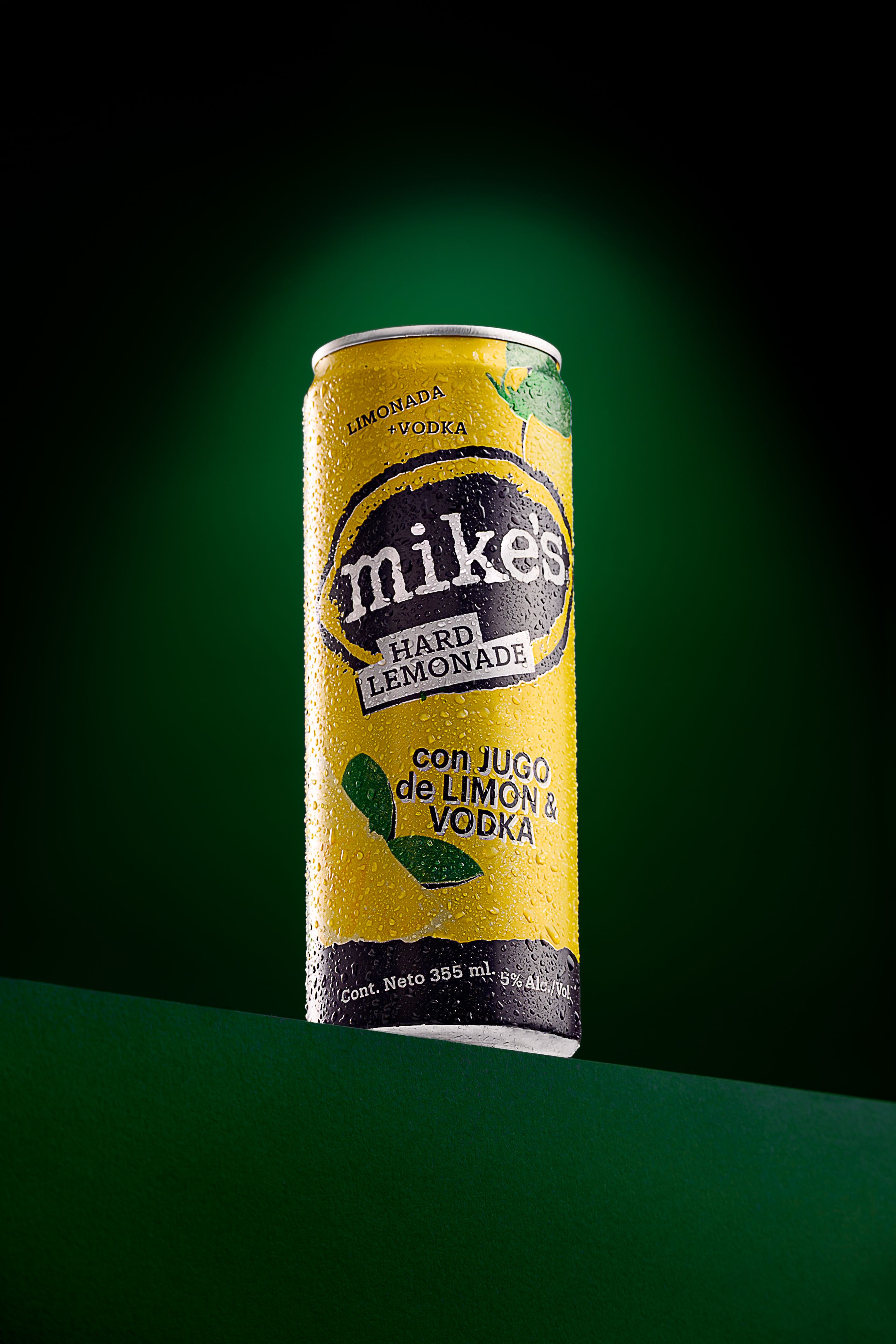 A vibrant shot of a Mike's Hard Lemonade can featuring lemon and vodka.