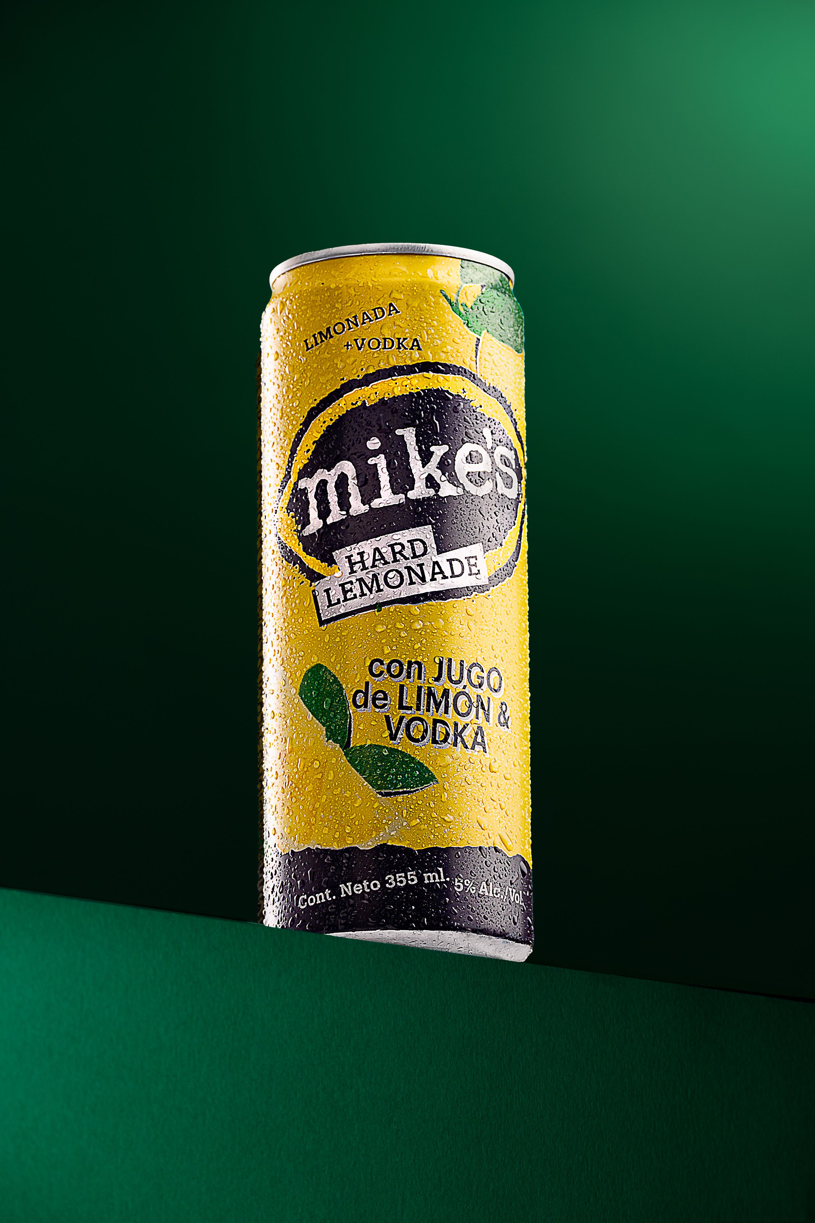 Close-up of a refreshing lemonade vodka can, showcasing vibrant packaging and condensation droplets.
