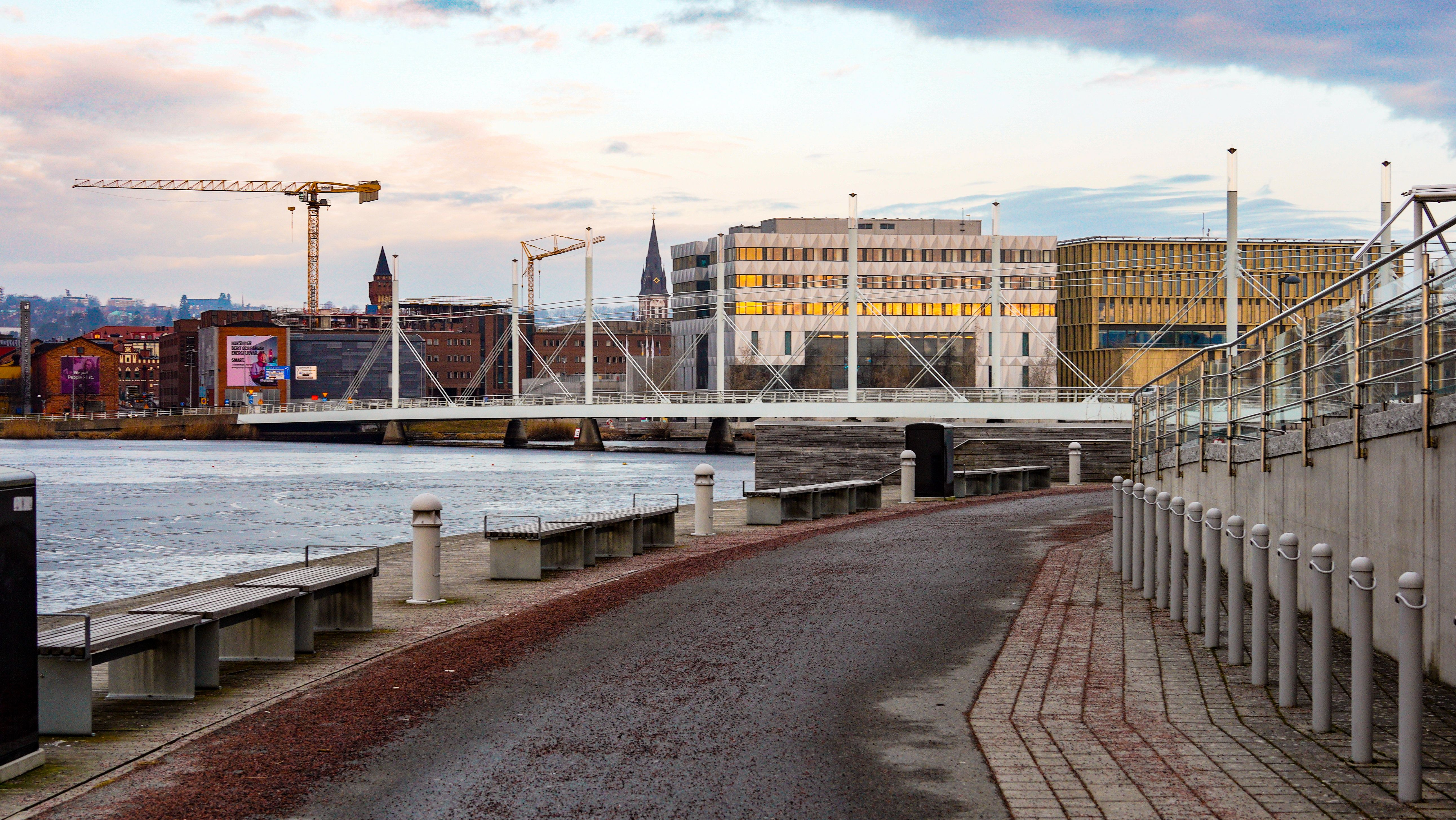 Stunning waterfront view in Jönköping, Sweden with modern architecture and serene river.