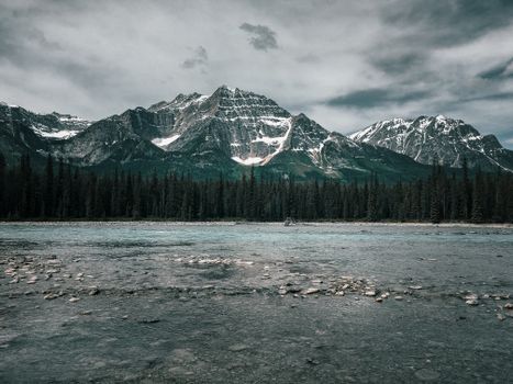 Breathtaking view of the Rocky Mountains and river in Alberta, Canada.