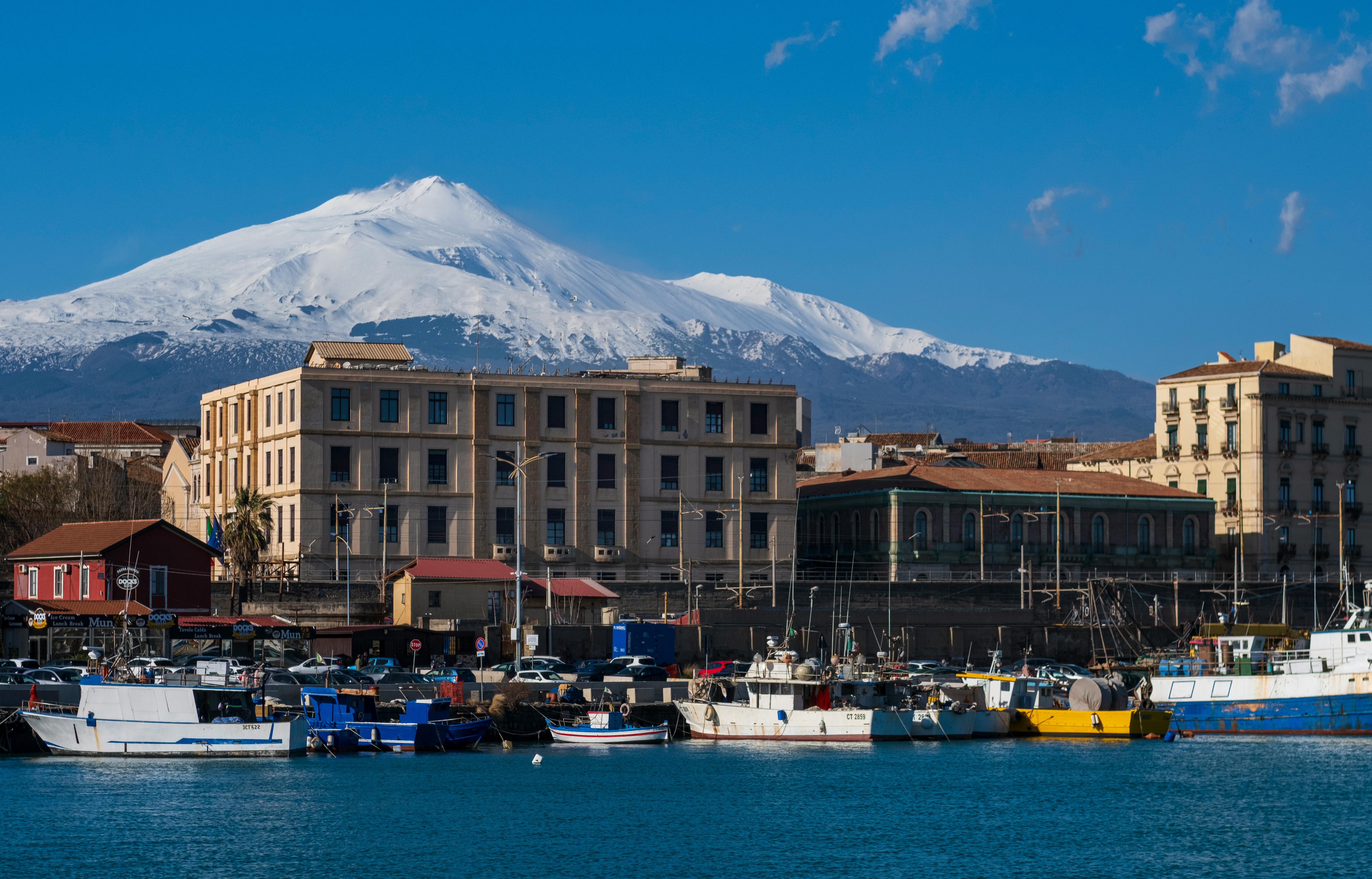 View of Mount Etna with snowy peaks over Catania