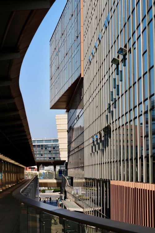 Free Tall glass buildings reflecting sunlight in an urban setting. Stock Photo