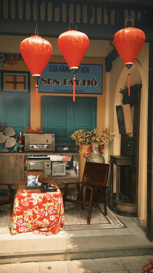 Free Traditional Vietnamese shopfront with lanterns and vintage decor, creating a nostalgic ambiance. Stock Photo