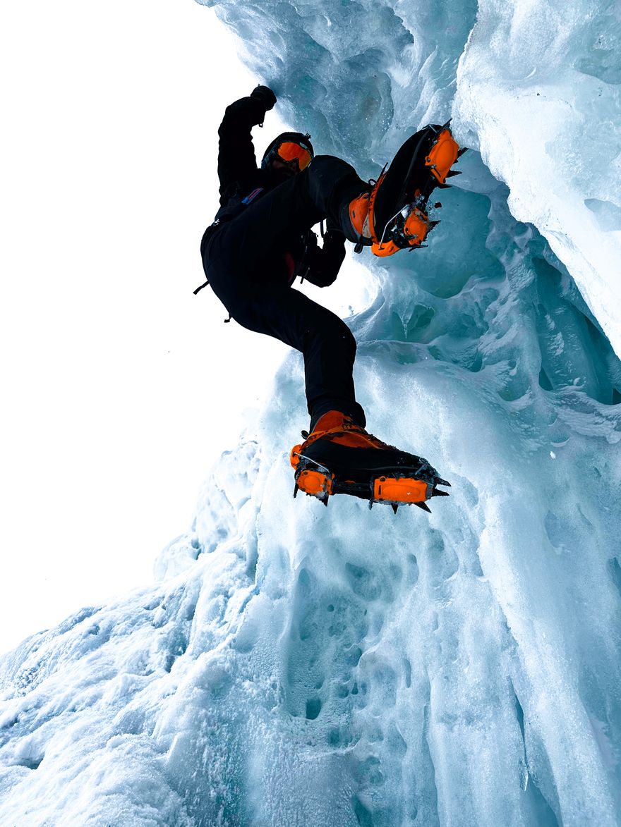 Photo by Ahmet utku Deliveli on Pexels — an ice climber on a towering ice wall
