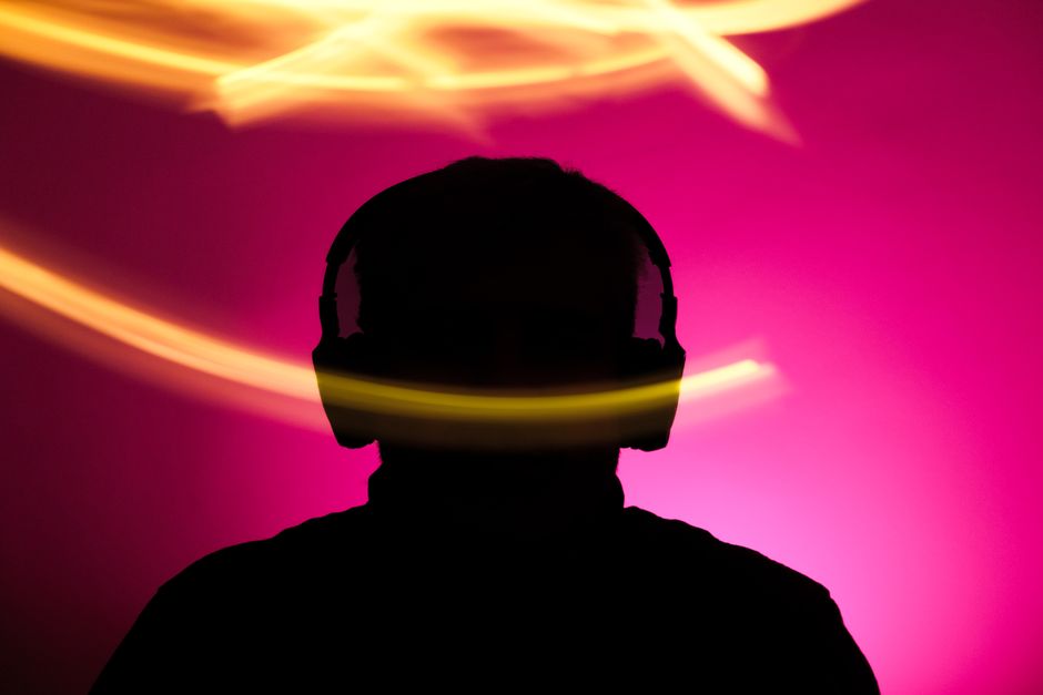 Headphones with sound waves, representing AI music generation