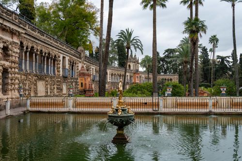 Free Discover the intricate architecture and lush gardens of Seville's Alcazar, a UNESCO World Heritage Site. Stock Photo