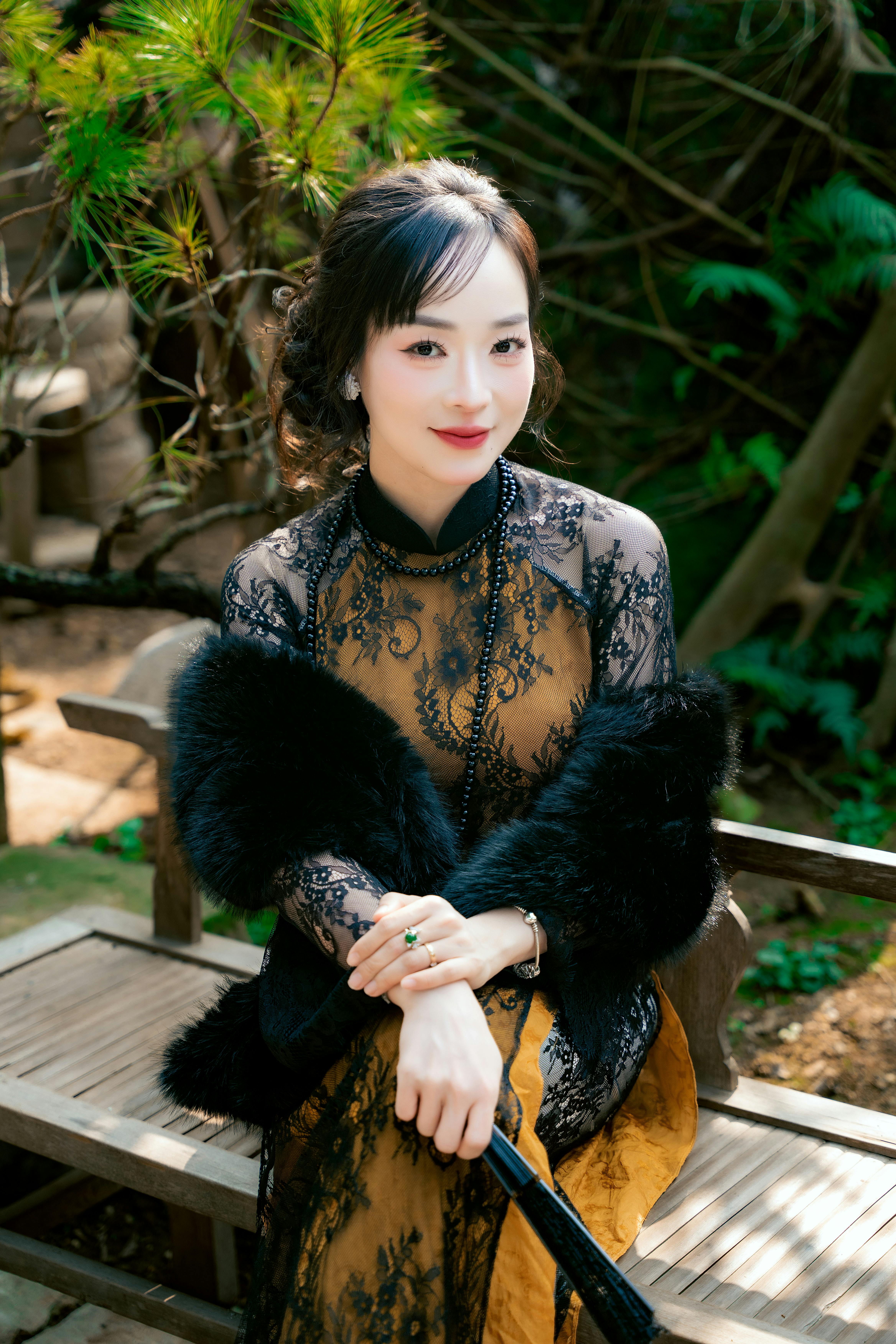 Elegant Woman in Vintage Lace Dress Outdoors