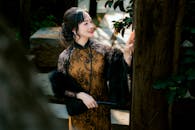 Elegant Woman in Traditional Asian Attire Outdoors