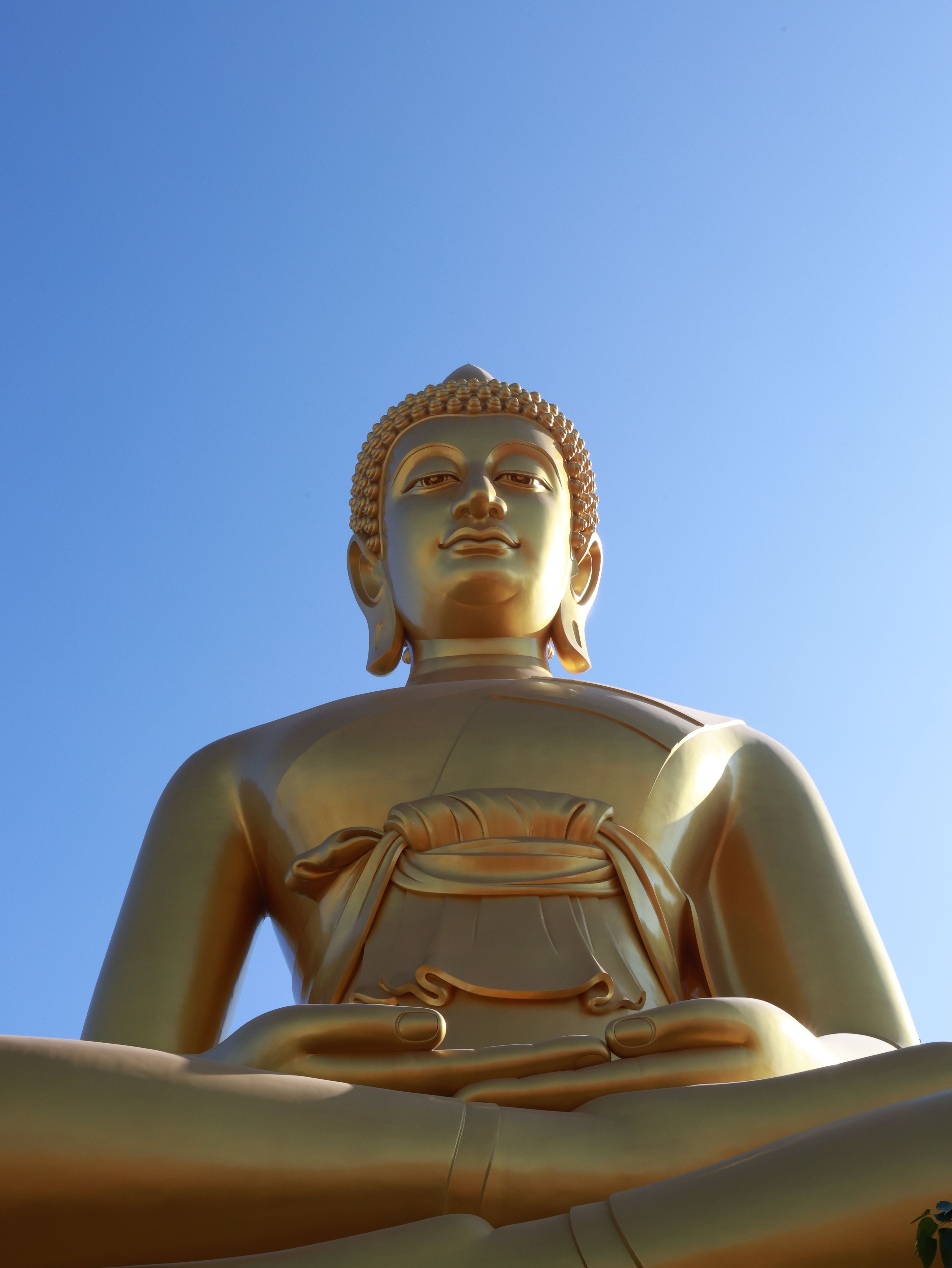 Golden Buddha Statue Against Clear Blue Sky · Free Stock Photo