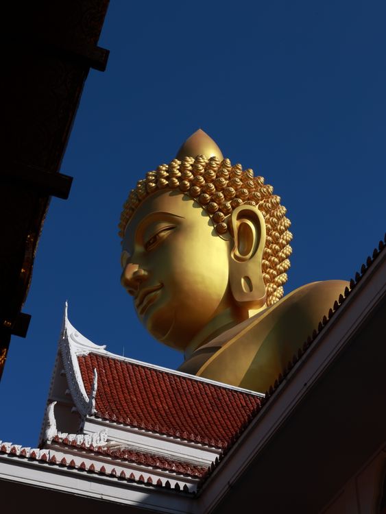 Golden Buddha Statue Against Clear Blue Sky · Free Stock Photo