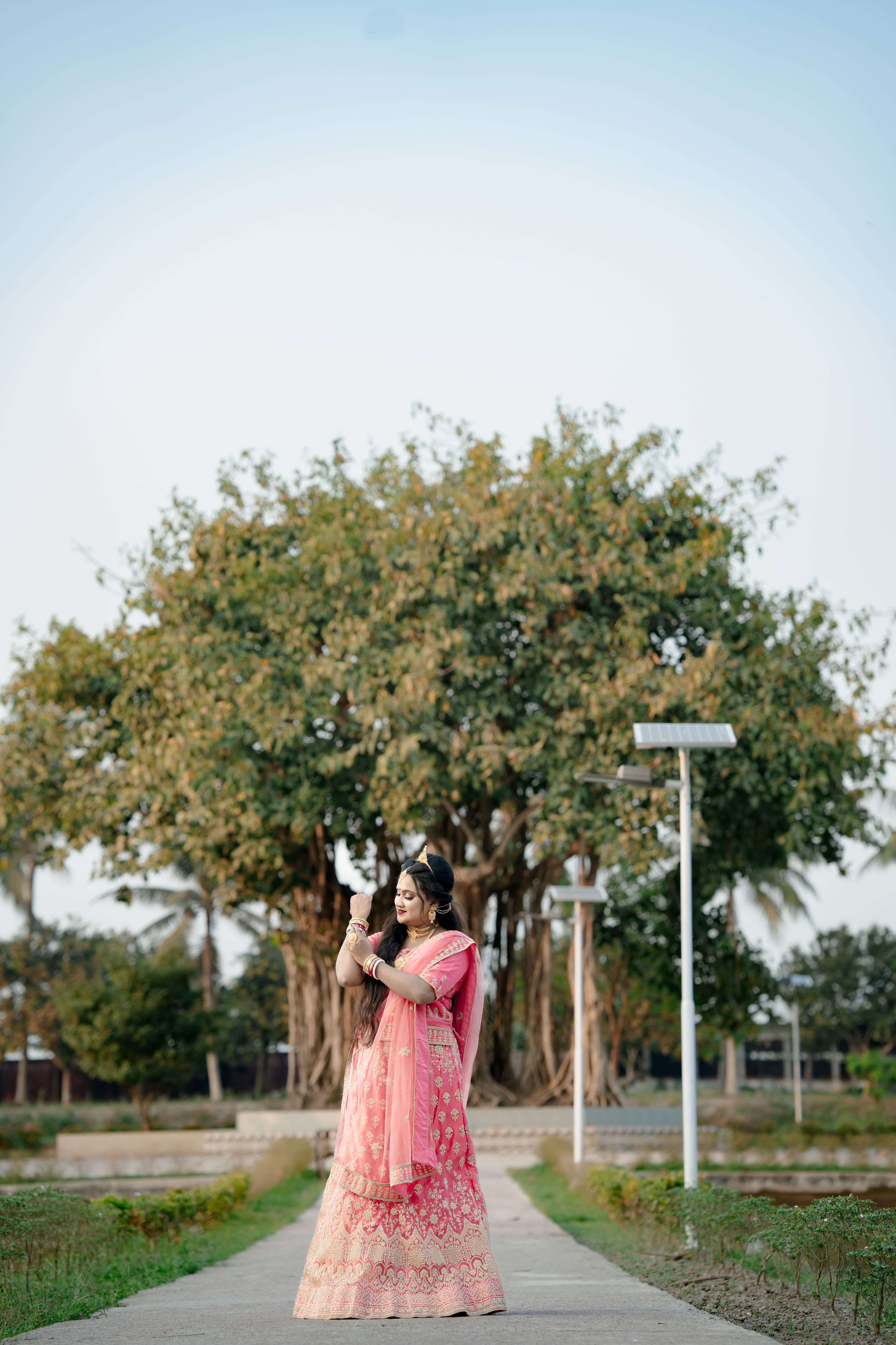 Woman in Traditional Dress Under a Tree · Free Stock Photo