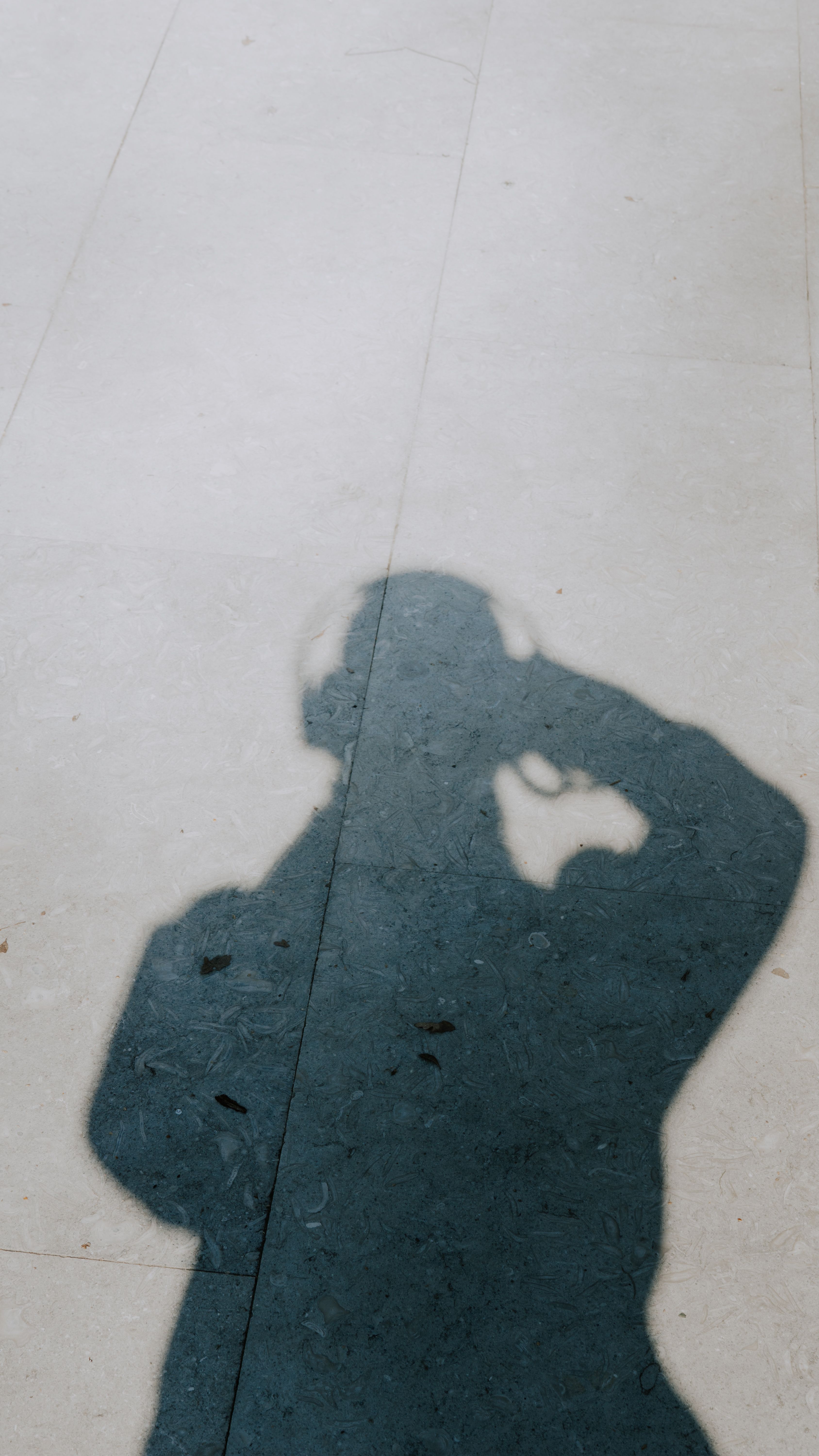 Creative Shadow Silhouette on Pavement · Free Stock Photo