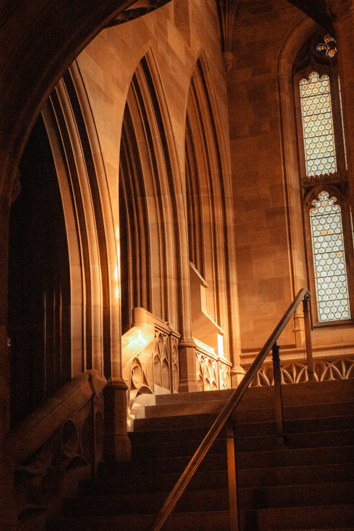 Free Arching stone staircase in a Gothic Victorian library in Manchester, England. Stock Photo