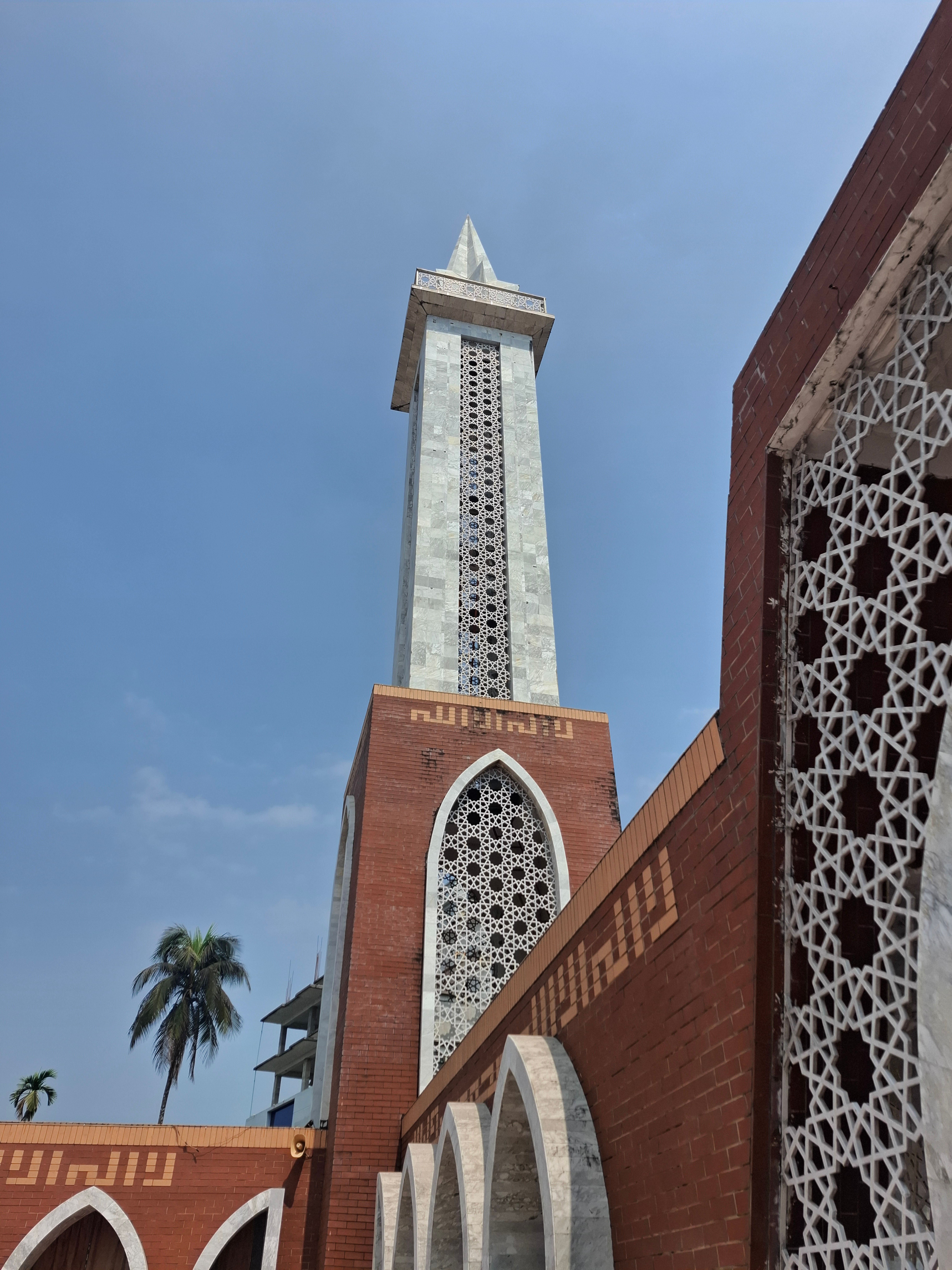 Stunning view of a mosque minaret with intricate patterns in Barisal, Bangladesh.