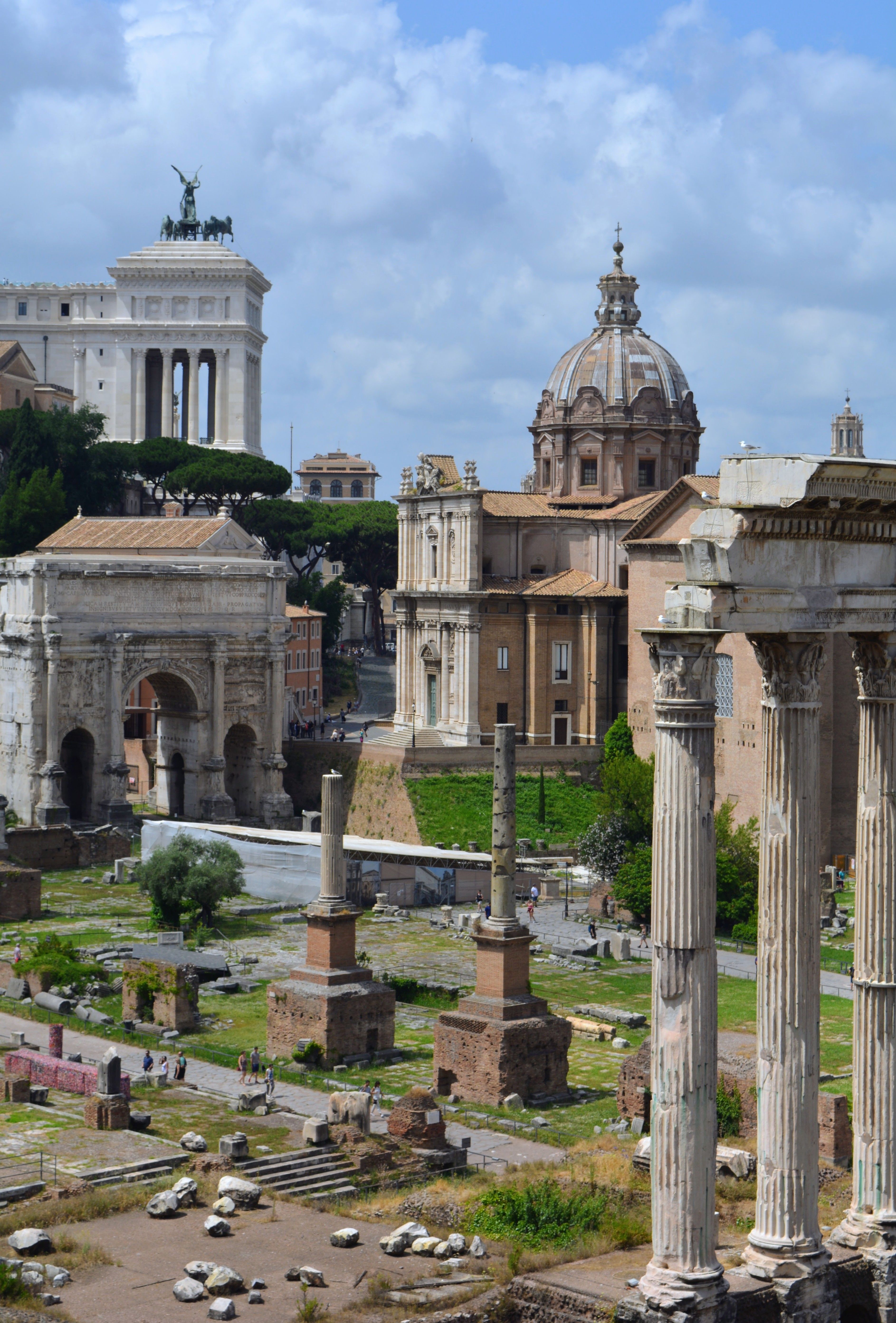 Ancient Roman Forum with Iconic Colosseum View · Free Stock Photo